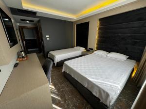 Postel nebo postele na pokoji v ubytování Miroglu Hotel + 37 fotografií
