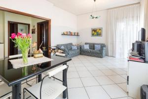 a living room with a couch and a table at Home sweet home in Nocera Inferiore