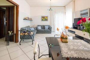 a living room with a couch and a table at Home sweet home in Nocera Inferiore