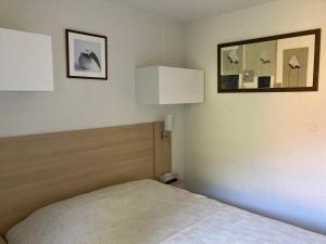 Ένα ή περισσότερα κρεβάτια σε δωμάτιο στο Appartement T2 Jardins de Ramel
