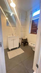 a bathroom with a sink and a toilet at Kust 3 in Egmond aan Zee +26 photos