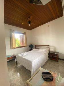 Ένα ή περισσότερα κρεβάτια σε δωμάτιο στο Hospedagem Familiar Cantinho Para-ti