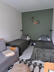 Postel nebo postele na pokoji v ubytování Ylläs Kanerva 107