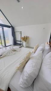 Postel nebo postele na pokoji v ubytování Cottage pinggan