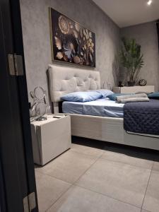 a bedroom with a bed and a table in it at Matilde Valletta Suites in Valletta