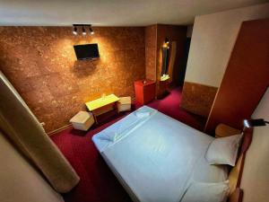 Postel nebo postele na pokoji v ubytování Korona Hotel