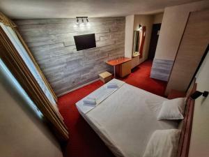 Postel nebo postele na pokoji v ubytování Korona Hotel