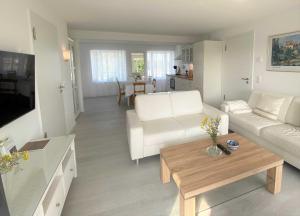 Et opholdsområde på Strandläufer mit Meerblick und Balkon