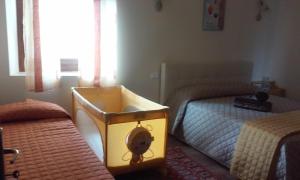 Voodi või voodid majutusasutuse Cadorna Chalet toas