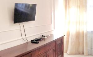 a television on top of a dresser in a room at Центр in Vinnytsya