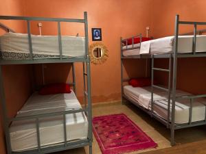 Postel nebo postele na pokoji v ubytování Riad dar Malak