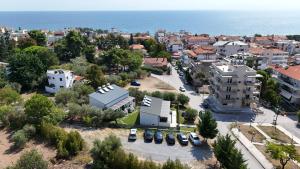 an aerial view of a city with the ocean at Gardy rooms in Nea Kallikrateia