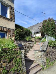 a set of stairs leading up to a house at Ferienhaus Änni Kempenich in Kempenich