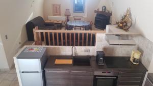 Kuchyň nebo kuchyňský kout v ubytování La Maison de Françoise à La Bourgarie
