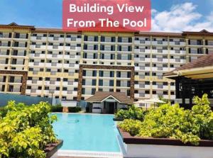 a view of the hotel from the pool at Your 2nd Home - One Oasis CDO in Cagayan de Oro