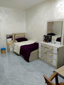 Postel nebo postele na pokoji v ubytování Ahmad Hostel