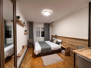 Ένα ή περισσότερα κρεβάτια σε δωμάτιο στο Lina Apartment