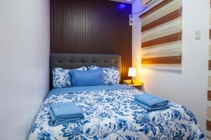 Postel nebo postele na pokoji v ubytování Triple A Residence Angeles City, Pampanga