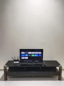 a flat screen tv sitting on top of a table at Seaview Emerald Sandakan in Sandakan