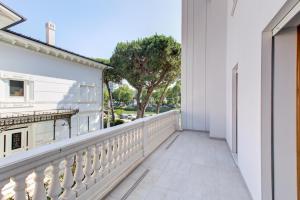 a balcony of a house with a white railing at Villa Italia in Cesenatico