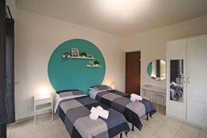 Postel nebo postele na pokoji v ubytování La cornice di Tivoli