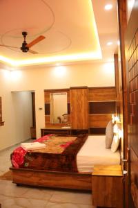 Ένα ή περισσότερα κρεβάτια σε δωμάτιο στο Romanzia Dew Drops