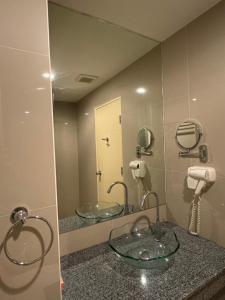 a bathroom with two sinks and a mirror at Cha-am , Cityscape Comfort , Near Cha-am Beach South in Cha Am +25 photos
