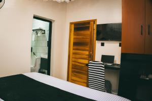 Ένα ή περισσότερα κρεβάτια σε δωμάτιο στο One Click Apartment
