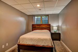 a small bedroom with a bed and a window at Eagles Haven in Eagle River