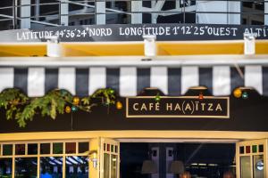 a cafe hadica sign on the front of a building at Ha(a)ïtza in Pyla-sur-Mer
