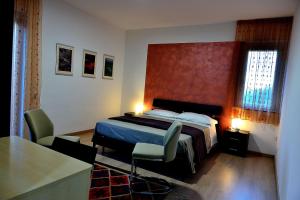 Posteľ alebo postele v izbe v ubytovaní Il triclinio B&B