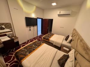 Postel nebo postele na pokoji v ubytování Star Suites