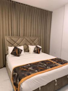 Postel nebo postele na pokoji v ubytování Star Suites