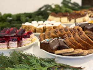 a table topped with plates of cakes and pastries at Willa Stożek, 50 m od term i wyciągów narciarskich in Białka Tatrzanska +109 photos