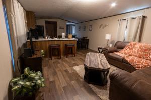 a living room with a couch and a table at Winding Way Retreat-Georgetown in Georgetown