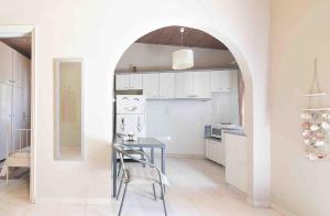 a kitchen with a table and a dining room at Mirsinia Room in Mérikhas
