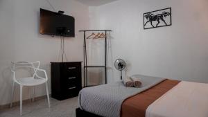 Giường trong phòng chung tại Casa MoraZ