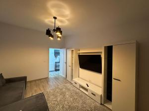 TV/trung tâm giải trí tại Zlata Comfort Apartment