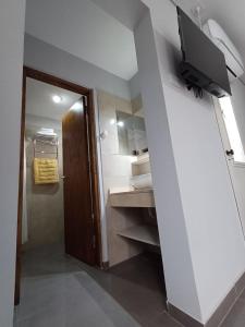 TV a/nebo společenská místnost v ubytování Departamentos corazón