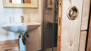 a bathroom with a sink and a shower at Escape to Comfort, Relax, and Love in Rome - Luxury Agriturismo 5 Suites in La Giustiniana +39 photos