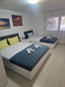 Postel nebo postele na pokoji v ubytování Pamys House