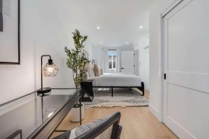 a white bedroom with a bed in a room at Brand New Apt W Parking Blocks From Downtown- D in Sunnyvale
