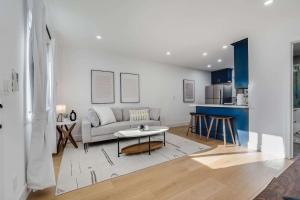 a living room with a couch and a table at Brand New Apt W Parking Blocks From Downtown- B in Sunnyvale