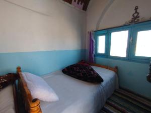 Postel nebo postele na pokoji v ubytování Nubian Dreams House + 10 fotografií