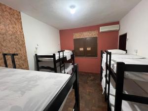 Postel nebo postele na pokoji v ubytování Calango Hostel