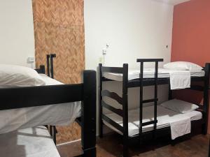 Postel nebo postele na pokoji v ubytování Calango Hostel