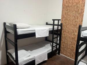 Postel nebo postele na pokoji v ubytování Calango Hostel
