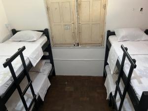 Postel nebo postele na pokoji v ubytování Calango Hostel