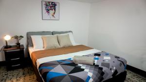 Giường trong phòng chung tại Casa MoraZ