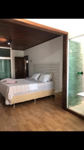 Cama o camas de una habitación en Casa Espaçosa e Aconchegante